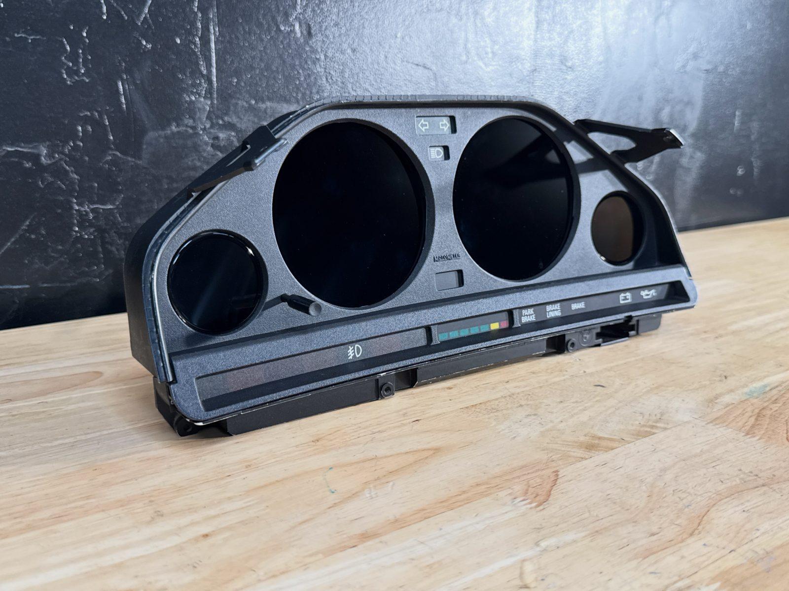 The E30 prototype on the workshop bench, showing the original housing and circular displays